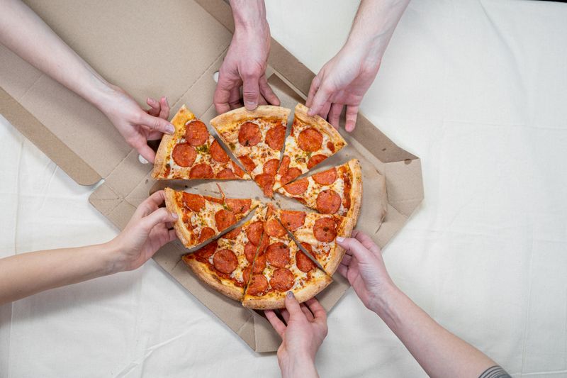 Fresh ranch pizza laid out at a catered gathering